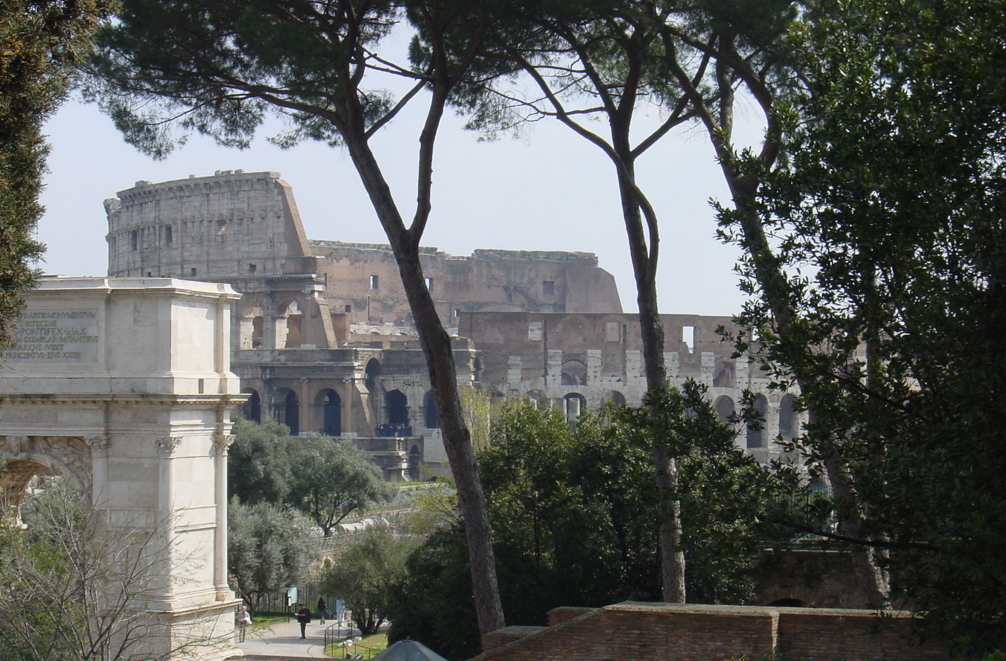 Image of the Colosseum with Arch of Titus in foreground